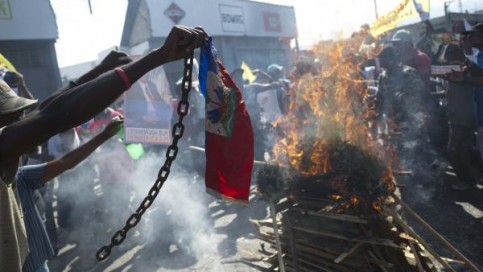 L'opposition haïtienne a une nouvelle fois manifesté samedi 13 décembre pour réclamer le départ du gouvernement et du président Martelly. AFP/Hector Retamal